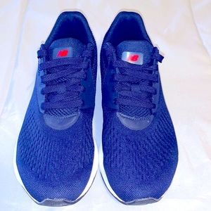 New Balance, size 8, wide width, men’s running shoes in navy blue. Item is new.